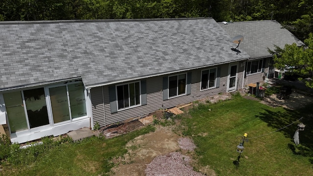 422 Cross Rd, Swanville, ME 04915 - rear view of house with a shingled roof and a yard