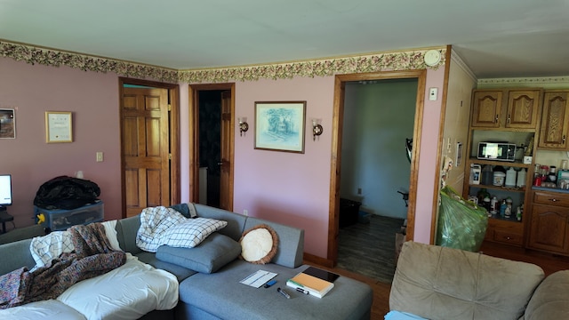 422 Cross Rd, Swanville, ME 04915 - living room featuring crown molding and wood finished floors
