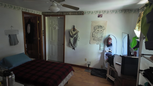 422 Cross Rd, Swanville, ME 04915 - bedroom featuring wood finished floors, ceiling fan, and baseboards