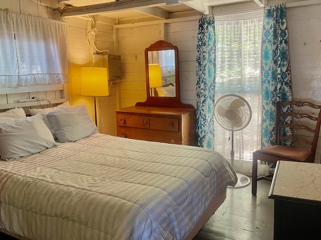 51 Rock Haven Dr, West Bath, ME 04530 - bedroom featuring multiple windows, wood finished floors, and wooden walls