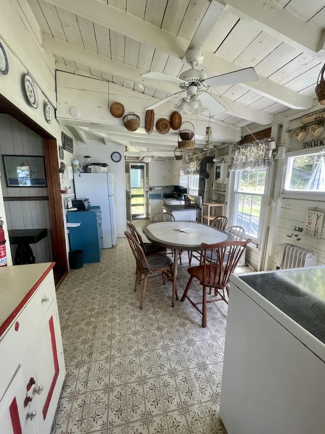 51 Rock Haven Dr, West Bath, ME 04530 - dining space with wooden ceiling with exposed beams, light floors, ceiling fan, and radiator