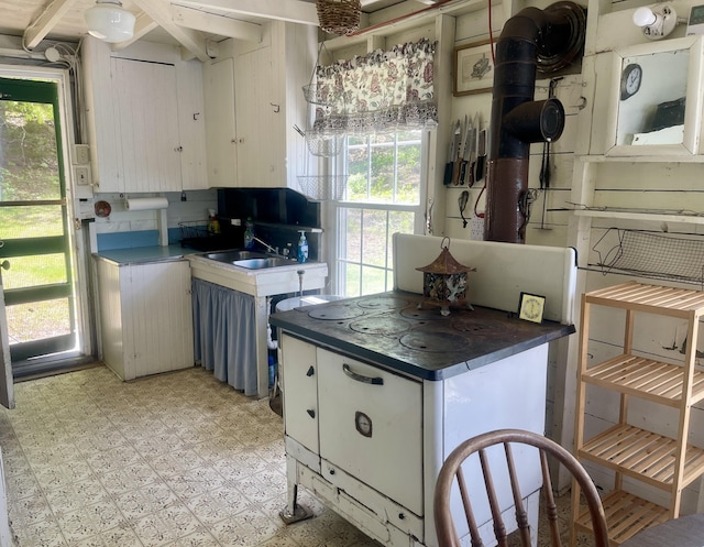 51 Rock Haven Dr, West Bath, ME 04530 - kitchen with plenty of natural light, dark countertops, and a sink