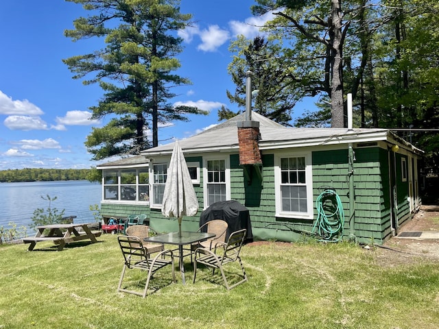 51 Rock Haven Dr, West Bath, ME 04530 - rear view of property with a yard, a sunroom, and a water view