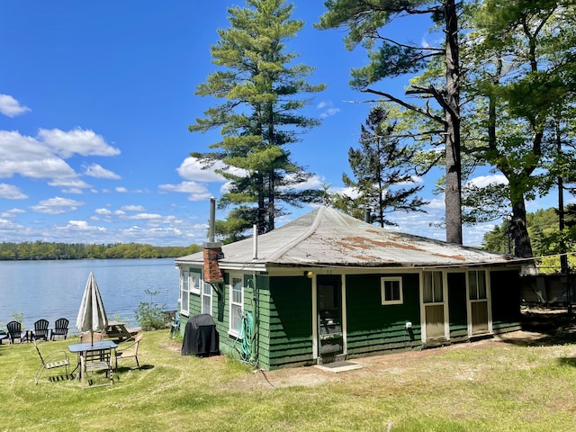 51 Rock Haven Dr, West Bath, ME 04530 - rear view of house featuring a yard and a water view