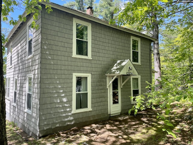 51 Rock Haven Dr, West Bath, ME 04530 - rear view of property with a chimney