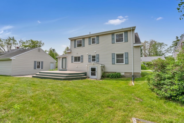 61 Carlyle Rd, Portland, ME 04103 - back of property with a lawn and a deck