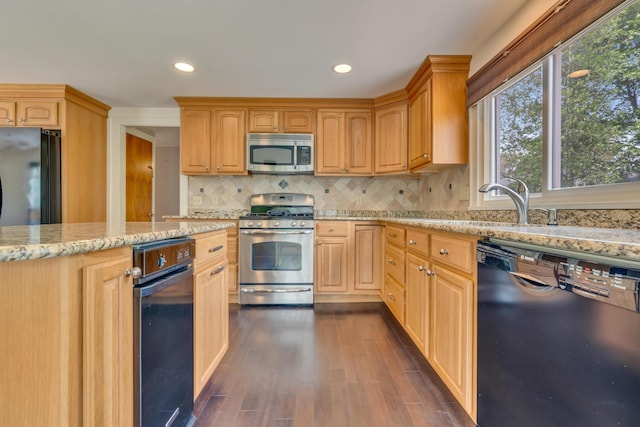 61 Carlyle Rd, Portland, ME 04103 - kitchen with stainless steel appliances, healthy amount of natural light, light stone counters, decorative backsplash, and recessed lighting