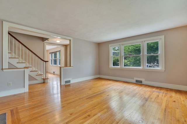 61 Carlyle Rd, Portland, ME 04103 - spare room with hardwood / wood-style floors, baseboards, and stairway
