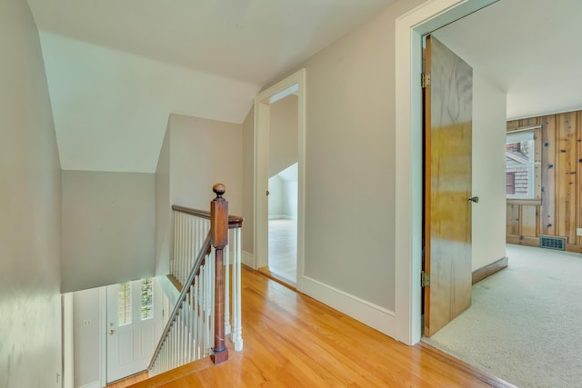 61 Carlyle Rd, Portland, ME 04103 - hallway featuring an upstairs landing, wood finished floors, baseboards, and vaulted ceiling