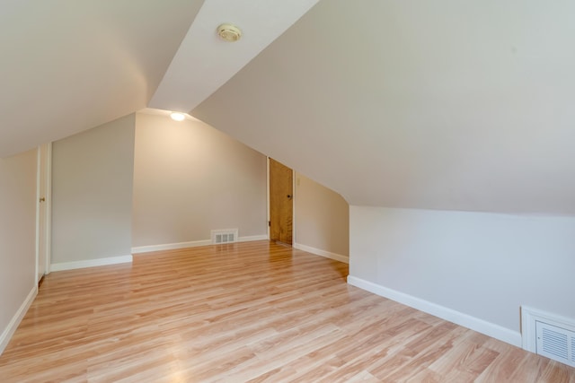 61 Carlyle Rd, Portland, ME 04103 - additional living space featuring light wood finished floors, vaulted ceiling, and baseboards