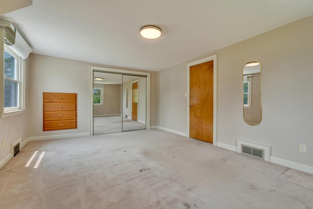 61 Carlyle Rd, Portland, ME 04103 - unfurnished bedroom featuring a closet, carpet flooring, and baseboards