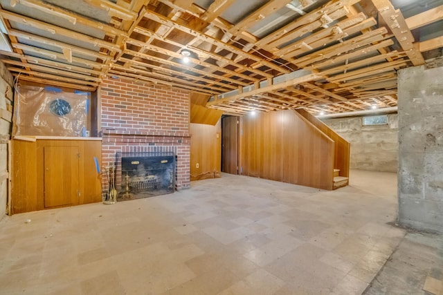 61 Carlyle Rd, Portland, ME 04103 - unfinished below grade area with a brick fireplace, stairway, and tile patterned floors