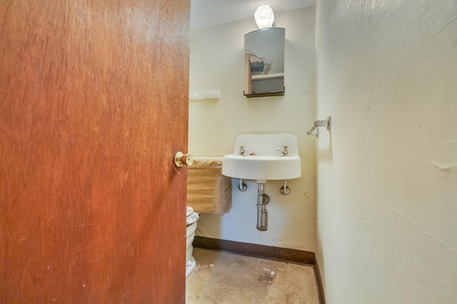 61 Carlyle Rd, Portland, ME 04103 - half bath with baseboards and toilet