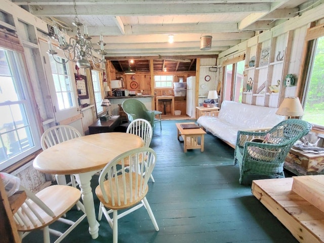 16 Mellen Ln, Wilton, ME 04294 - dining space with hardwood / wood-style flooring, plenty of natural light, and beam ceiling