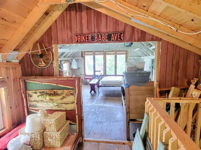 16 Mellen Ln, Wilton, ME 04294 - bedroom with lofted ceiling, wood walls, wood-type flooring, and wood ceiling