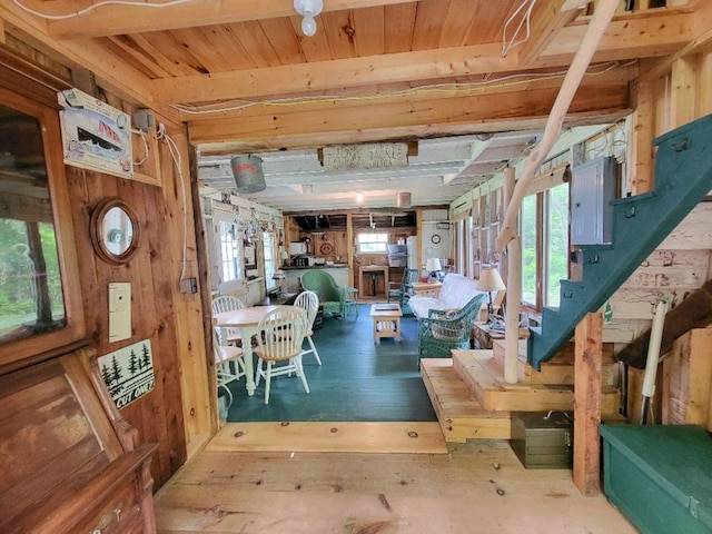 16 Mellen Ln, Wilton, ME 04294 - interior space with electric panel, wooden walls, and stairway