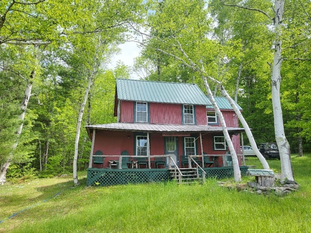 16 Mellen Ln, Wilton, ME 04294 - view of front of property featuring a porch and metal roof