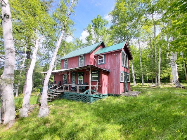 16 Mellen Ln, Wilton, ME 04294 - back of property featuring covered porch and metal roof