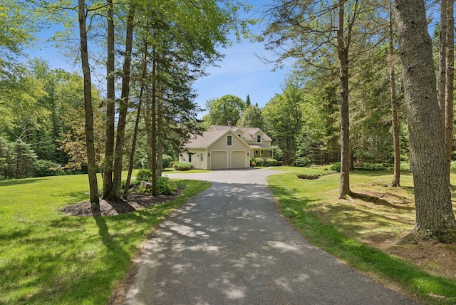 61 Crestview Ln, Brunswick, ME 04011 - view of front facade featuring asphalt driveway, a front yard, and a garage