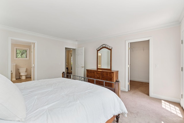 61 Crestview Ln, Brunswick, ME 04011 - bedroom with crown molding, a spacious closet, a closet, connected bathroom, and light carpet
