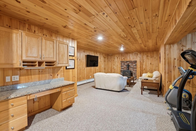 61 Crestview Ln, Brunswick, ME 04011 - bedroom with a wood stove, light colored carpet, wood ceiling, a baseboard radiator, and wooden walls