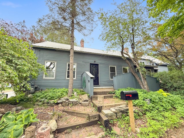 99 Kenduskeag Ave, Bangor, ME 04401 - back of house featuring a chimney and metal roof