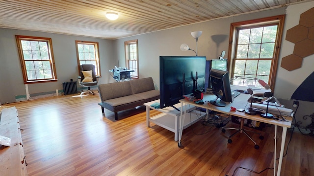 99 Kenduskeag Ave, Bangor, ME 04401 - office area featuring radiator heating unit, light wood-style flooring, and wood ceiling