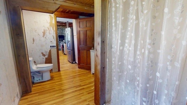 99 Kenduskeag Ave, Bangor, ME 04401 - bathroom featuring wood finished floors, toilet, beam ceiling, and a shower with shower curtain