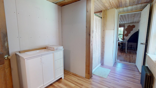 99 Kenduskeag Ave, Bangor, ME 04401 - bathroom with radiator heating unit, wood finished floors, wood ceiling, and vanity