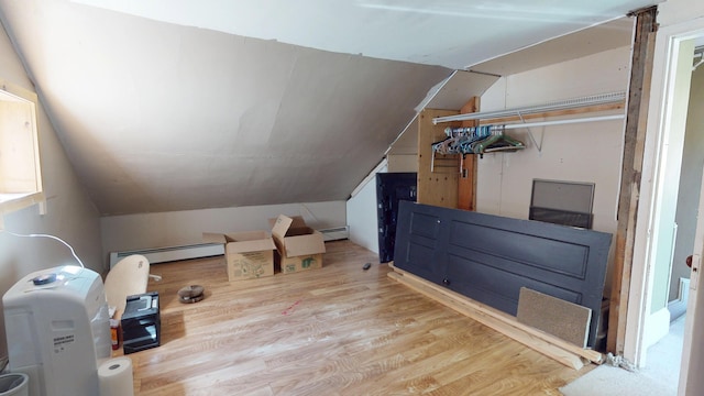 99 Kenduskeag Ave, Bangor, ME 04401 - bonus room featuring lofted ceiling, a baseboard radiator, and wood finished floors