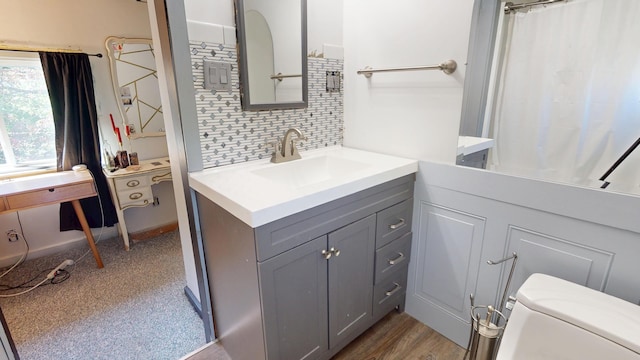 99 Kenduskeag Ave, Bangor, ME 04401 - full bathroom with vanity, decorative backsplash, toilet, and curtained shower