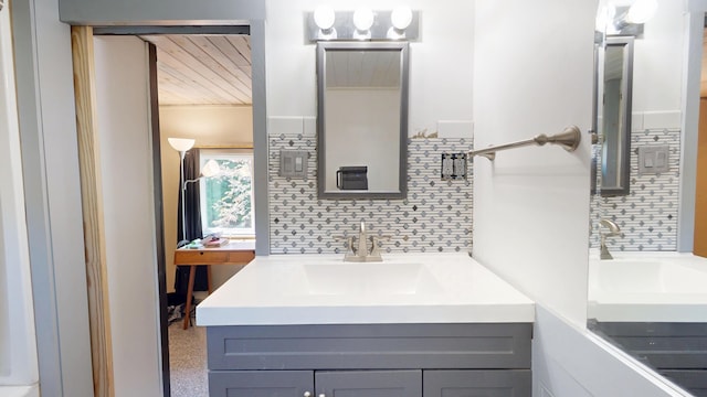 99 Kenduskeag Ave, Bangor, ME 04401 - bathroom with wood ceiling, backsplash, and vanity