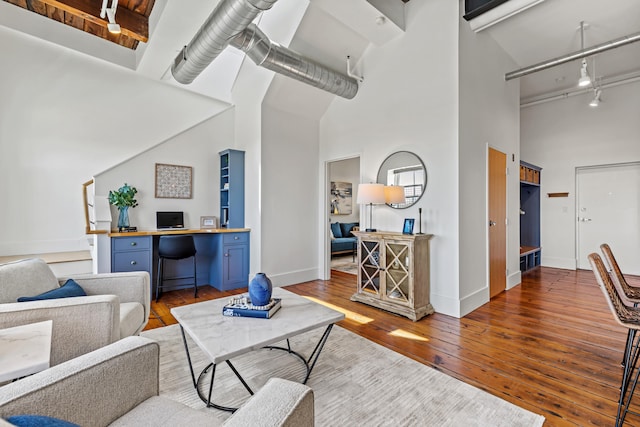 15 Brown St Unit 405, Portland, ME 04101 - living room with a high ceiling, track lighting, hardwood / wood-style floors, and baseboards
