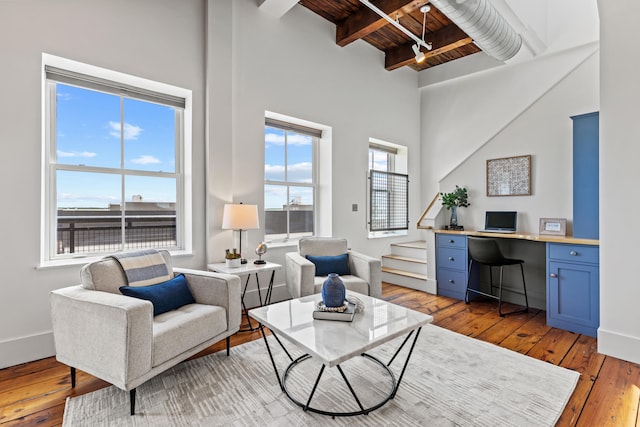 15 Brown St Unit 405, Portland, ME 04101 - living area featuring wooden ceiling with exposed beams, light wood finished floors, stairway, an office area, and baseboards