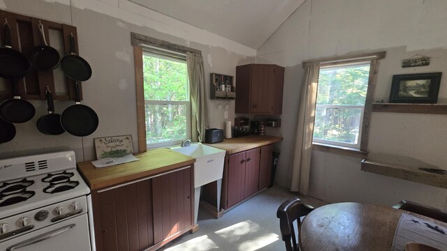 55.4AC Fire Rd, Linneus, ME 04730 - kitchen featuring white gas range and lofted ceiling