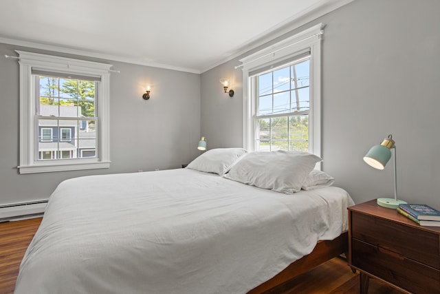 797 Main St, South Portland, ME 04106 - bedroom with wood finished floors, crown molding, and a baseboard radiator