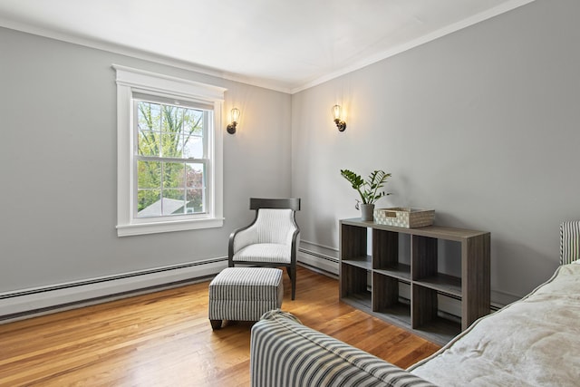 797 Main St, South Portland, ME 04106 - bedroom with baseboard heating, ornamental molding, and wood finished floors