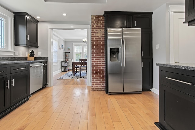 797 Main St, South Portland, ME 04106 - kitchen with stainless steel appliances, a chandelier, dark cabinetry, baseboards, and recessed lighting