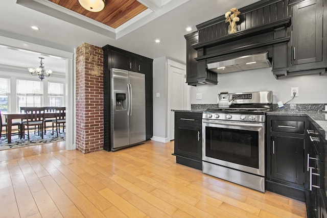 797 Main St, South Portland, ME 04106 - kitchen featuring appliances with stainless steel finishes, dark cabinetry, a chandelier, crown molding, and light wood-style flooring