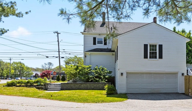 797 Main St, South Portland, ME 04106 - view of front of property with a garage, roof with shingles, driveway, and a front yard