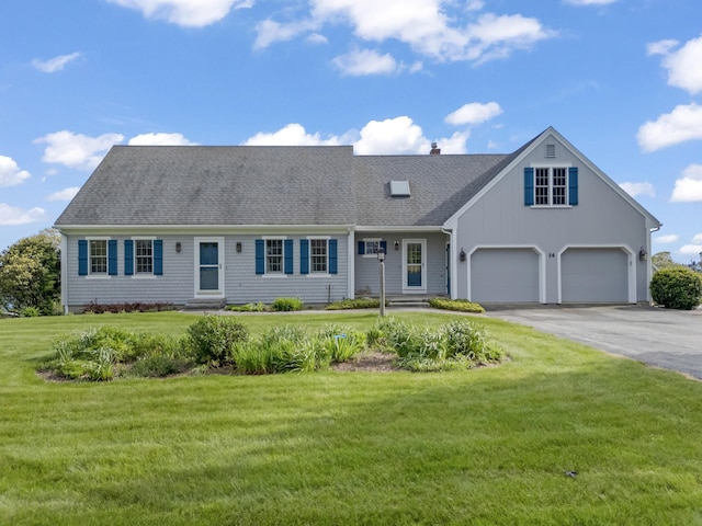 14 Merriconeag Ln, Harpswell, ME 04079 - view of front facade with driveway, roof with shingles, a front yard, board and batten siding, and an attached garage