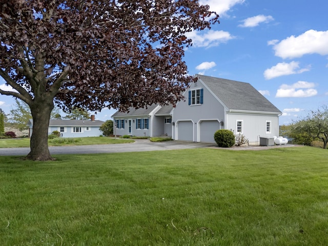 14 Merriconeag Ln, Harpswell, ME 04079 - view of front of property featuring a garage, driveway, a front lawn, and a shingled roof