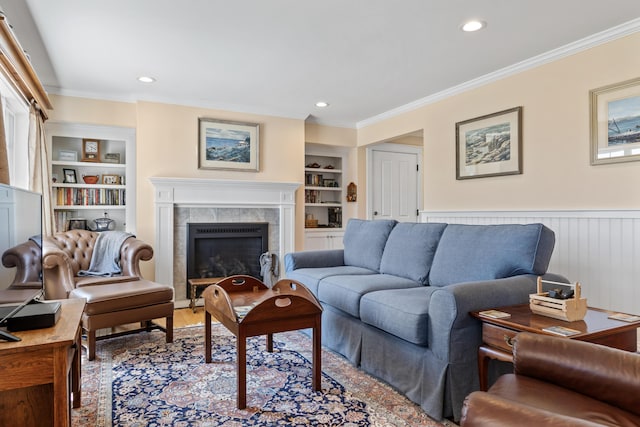 14 Merriconeag Ln, Harpswell, ME 04079 - living room featuring built in shelves, a high end fireplace, ornamental molding, recessed lighting, and wood finished floors