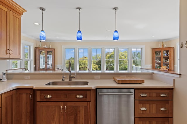 14 Merriconeag Ln, Harpswell, ME 04079 - kitchen featuring stainless steel dishwasher, a sink, light countertops, brown cabinets, and ornamental molding