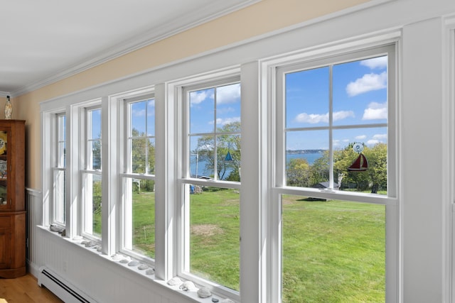 14 Merriconeag Ln, Harpswell, ME 04079 - doorway with a water view, ornamental molding, and light wood finished floors