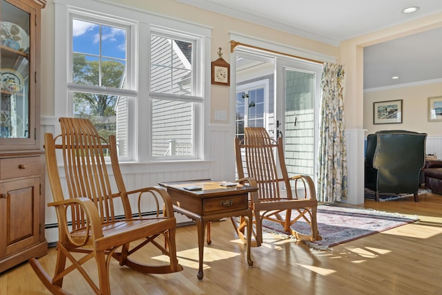 14 Merriconeag Ln, Harpswell, ME 04079 - sitting room featuring a desk, crown molding, wainscoting, light wood-style floors, and a decorative wall