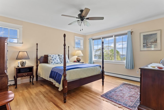14 Merriconeag Ln, Harpswell, ME 04079 - bedroom with baseboard heating, light wood finished floors, ornamental molding, ceiling fan, and baseboards