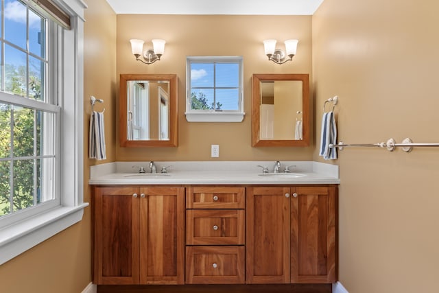 14 Merriconeag Ln, Harpswell, ME 04079 - bathroom with plenty of natural light, double vanity, and baseboards