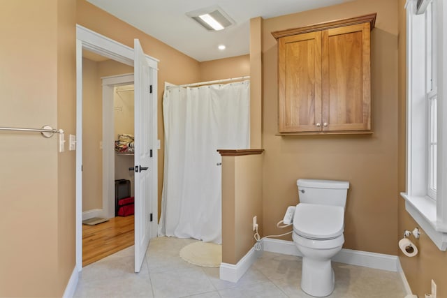 14 Merriconeag Ln, Harpswell, ME 04079 - bathroom with toilet, curtained shower, baseboards, and tile patterned floors
