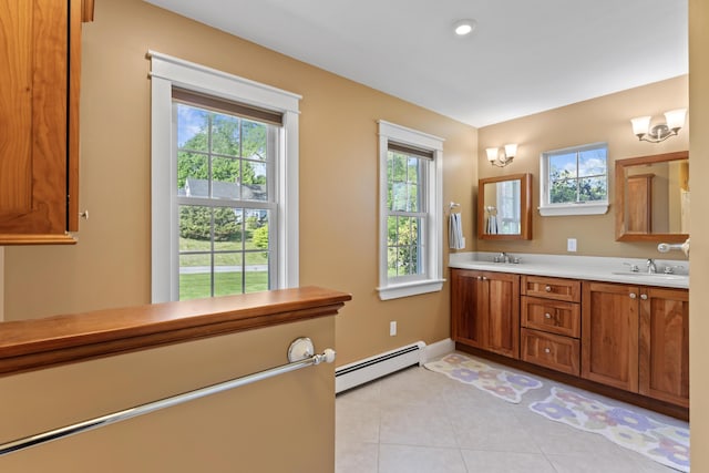 14 Merriconeag Ln, Harpswell, ME 04079 - bathroom with a baseboard radiator, double vanity, tile patterned flooring, and baseboards